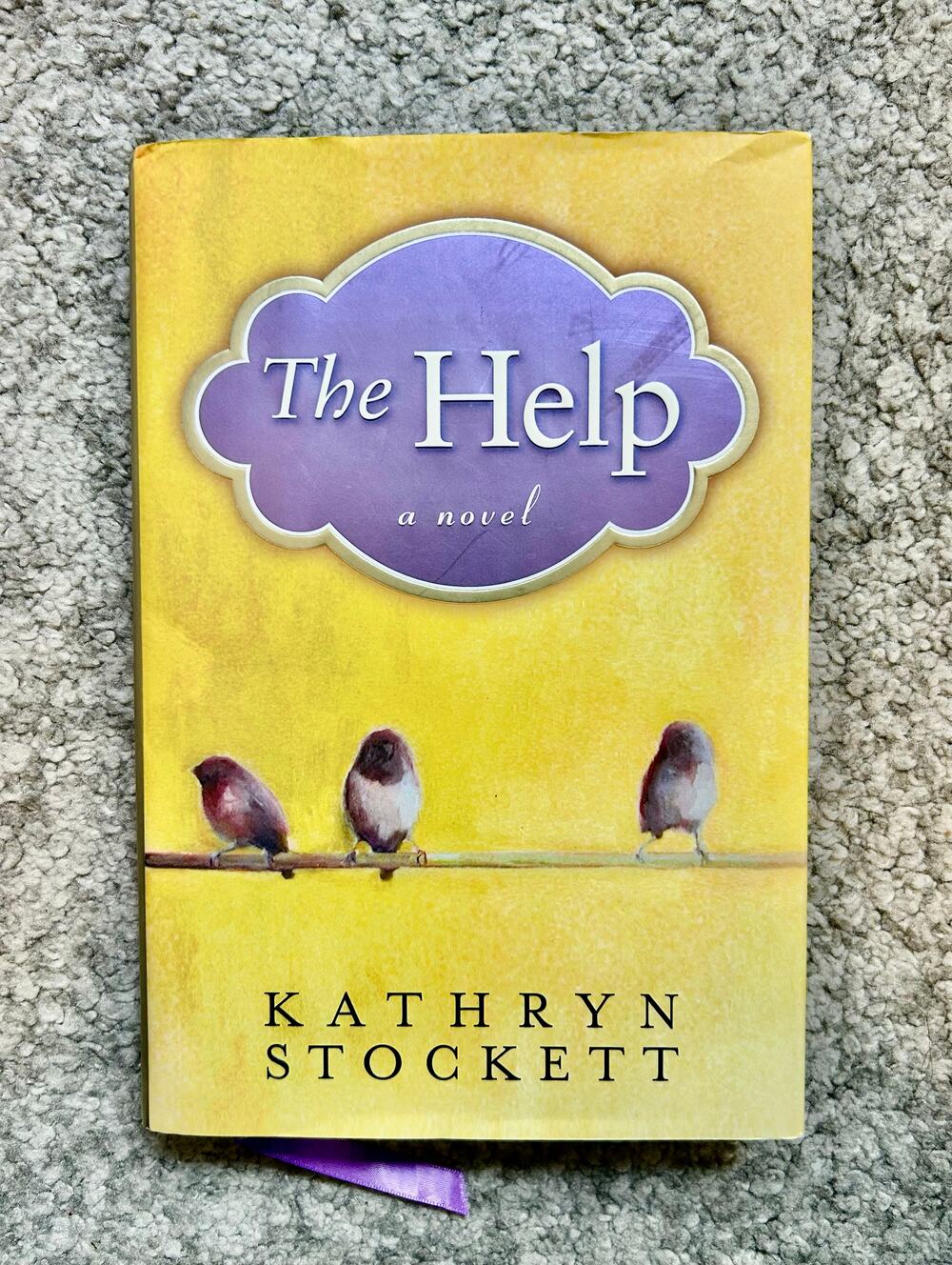 The Help by Kathryn Stockett hardcover novel with yellow dust jacket